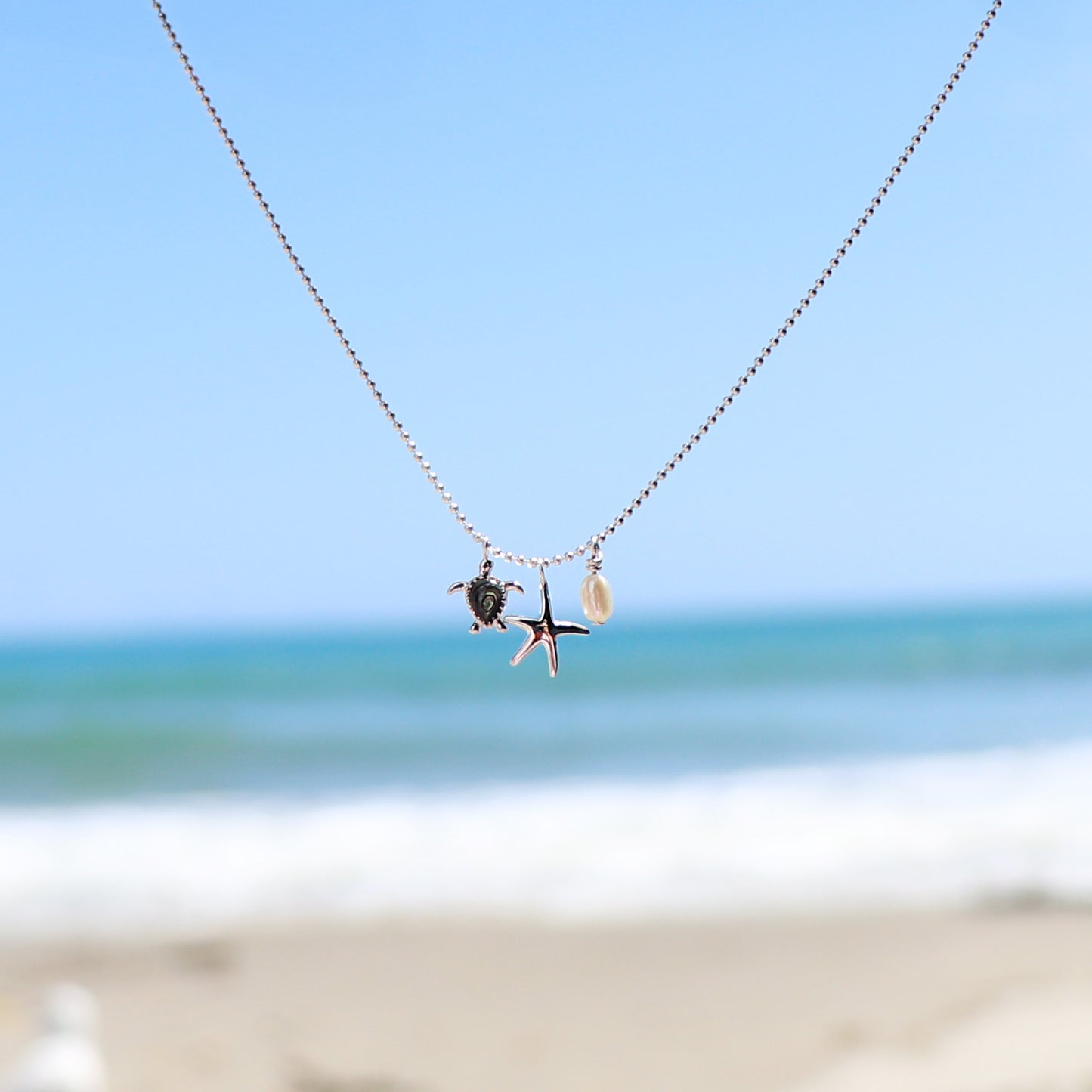 Sterling Silver and Pāua Turtle, Starfish + Pearl Necklace