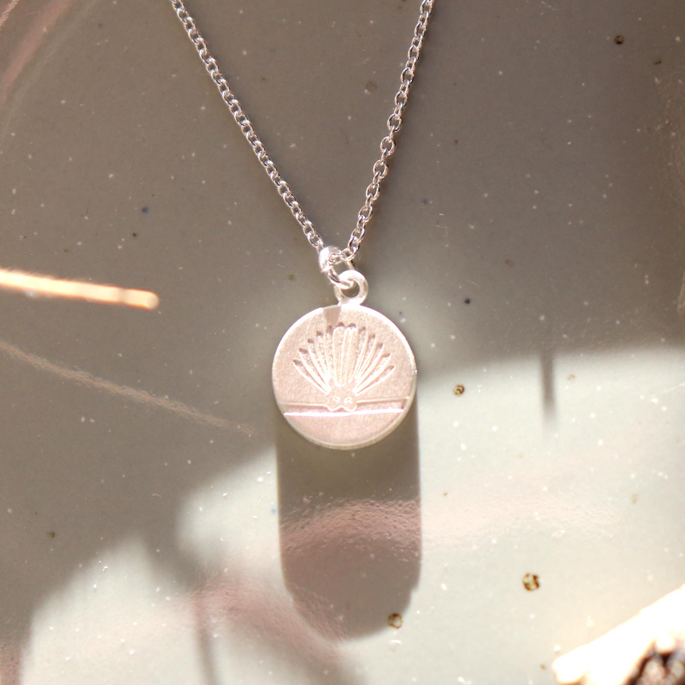 Keke Silver Playful piwakawaka fantail etched silver necklace NZ jewellery